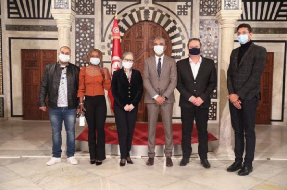  PM meets with champions Hafnaoui, Belkhir